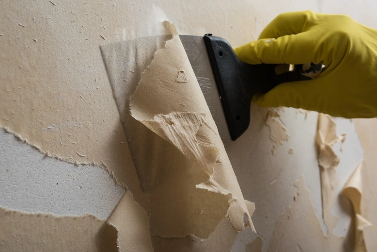Professional wallpaper removal service in progress